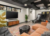 Thumbnail 6 of 19 - The Hemlock Apartments in Seattle, Washington Clubhouse Lounge with Games and TV at The Hemlock, Seattle, 98103