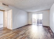 Thumbnail 29 of 29 - A room with wooden flooring and a window with blinds.