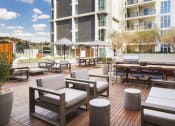 Thumbnail 5 of 28 - Pet-Friendly Apartments in Hollywood CA - The Fifty Five Fifty - Grill Area with Outdoor Lounge Seating