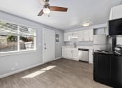 Thumbnail 1 of 8 - North River Apartments kitchen with a large window and a ceiling fan