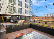 Thumbnail 12 of 19 - The Hemlock Apartments in Seattle, Washington Rooftop Patio with BBQ at The Hemlock, Washington, 98103