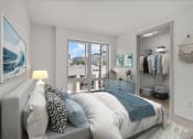 Thumbnail 3 of 28 - a bedroom with a bed and a closet and a sliding glass door
