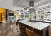 Thumbnail 12 of 28 - the lobby of a restaurant with a large white table and chairs