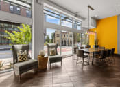 Thumbnail 14 of 28 - the preserve at ballantyne commons clubhouse with dining table and large windows