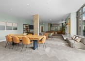 Thumbnail 2 of 21 - a dining room with a wooden table and chairs