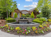 Thumbnail 15 of 43 - a fountain in front of a house