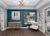 Thumbnail 7 of 39 - Novela Apartments Interior Front Entrance with Novela Sign