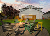 Thumbnail 1 of 26 - A fire pit surrounded by chairs in a backyard.