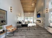 Thumbnail 13 of 26 - The Alexandar Apartments Clubhouse Seating and Fireplace