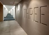 Thumbnail 28 of 35 - A hallway with the word THREE on the wall.