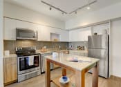 Thumbnail 2 of 30 - Sparc Apartments Model Kitchen and Island