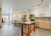 Thumbnail 1 of 30 - Sparc Apartments Model Kitchen and Dining Area