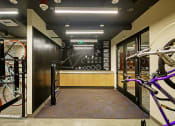 Thumbnail 19 of 48 - a room with bikes and a black wall with a chalkboard on it