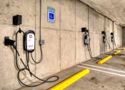 Thumbnail 28 of 48 - a row of charging stations on the wall of a parking garage