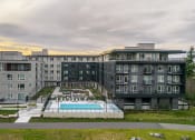 Thumbnail 43 of 48 - an aerial view of a building with a swimming pool