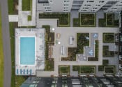 Thumbnail 37 of 48 - a birds eye view of a building with a pool and plants