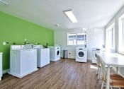 Thumbnail 24 of 36 - Parc East Apartments laundry room
