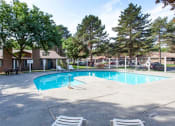 Thumbnail 14 of 26 - Arbropointe Apartments Pool with Lounge Chairs