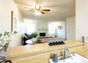 Thumbnail 15 of 26 - Arborpointe Apartments Model Kitchen and Living Room