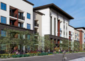 Thumbnail 6 of 9 - a rendering of an apartment building with a person riding a bike