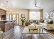 Thumbnail 31 of 35 - a living room with hardwood flooring and a ceiling fan