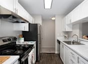 Thumbnail 11 of 21 - Bayview Apartment Homes Galley Kitchen and Appliances
