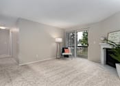 Thumbnail 8 of 21 - Bayview Apartment Homes Living Room and Patio Door Model Unit
