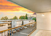 Thumbnail 17 of 18 - Beacon View Apartment Homes Balcony at Sunset