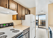 Thumbnail 10 of 18 - Beacon View Apartments Kitchen Appliances and Balcony View