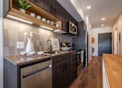 Thumbnail 16 of 28 - BEAM Apartments Model Kitchen
