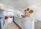 Thumbnail 7 of 13 - BLVD 120 Townhomes in Pleasant Grove, Utah Model Kitchen with Large Island
