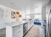 Thumbnail 4 of 13 - BLVD 120 Townhomes in Pleasant Grove, Utah Model Kitchen with Large Island