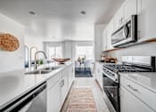 Thumbnail 5 of 13 - BLVD 120 Townhomes in Pleasant Grove, Utah Model Kitchen with Large Island