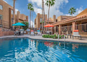 Thumbnail 1 of 13 - Catalina Crossing Apartments in Tucson, Arizona Pool with Lounge Chairs