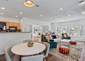 Thumbnail 19 of 30 - Cedar Crest Beaverton Oregon apartments resident lounge with couches and mini kitchen