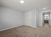 Thumbnail 11 of 30 - bedroom with closet door and view of the bathroom