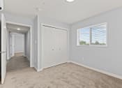 Thumbnail 16 of 30 - an empty room with a door and a window