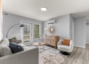 Thumbnail 4 of 30 - a living room with a couch and a chair