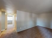 Thumbnail 9 of 16 - Eleven Pines Living Room and Hallway