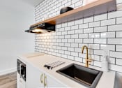 Thumbnail 7 of 18 - The Empire Apartments Model Kitchen