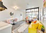 Thumbnail 6 of 18 - The Empire Apartments Model Kitchen & Living Area