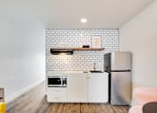Thumbnail 8 of 18 - The Empire Apartments Model Kitchen