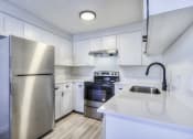 Thumbnail 3 of 26 - the preserve at ballantyne commons apartment kitchen with stainless steel appliances