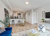 Thumbnail 8 of 29 - Geo Apartments Model Living Room and Dining Room
