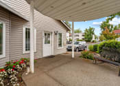 Thumbnail 10 of 14 - Gilhurst Apartments in Portland, Oregon Clubhouse Exterior and Covered Patio