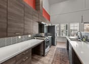 Thumbnail 17 of 44 - Prelude at Paramount Apartments Clubhouse Kitchen