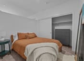 Thumbnail 7 of 20 - a bedroom with a bed and a closet