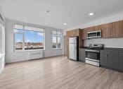 Thumbnail 3 of 20 - a kitchen with a stove and a refrigerator and a window