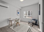 Thumbnail 19 of 21 - an office space with a desk and a chair and a window