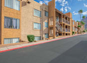 Thumbnail 13 of 13 - A street view of a residential area with apartment buildings.